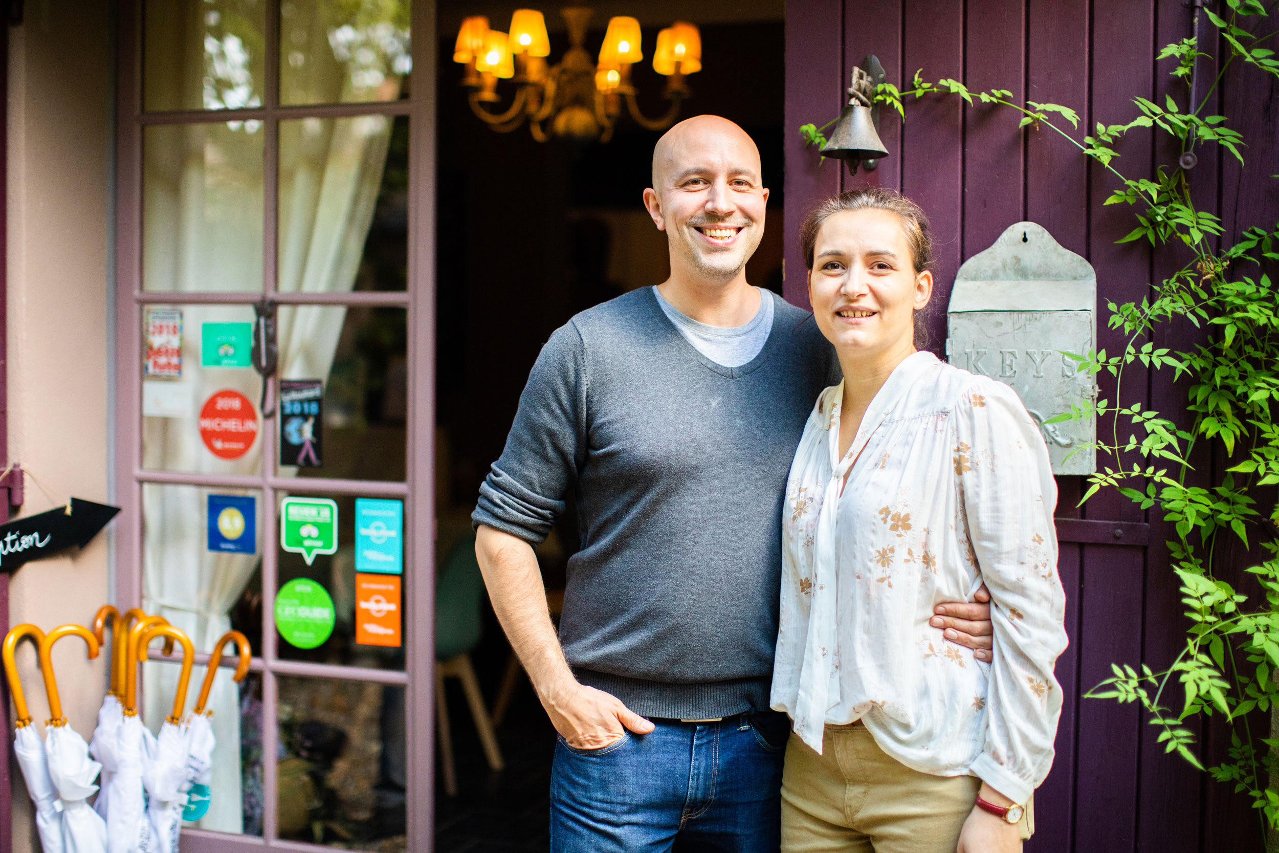 Couple standing in front of a door