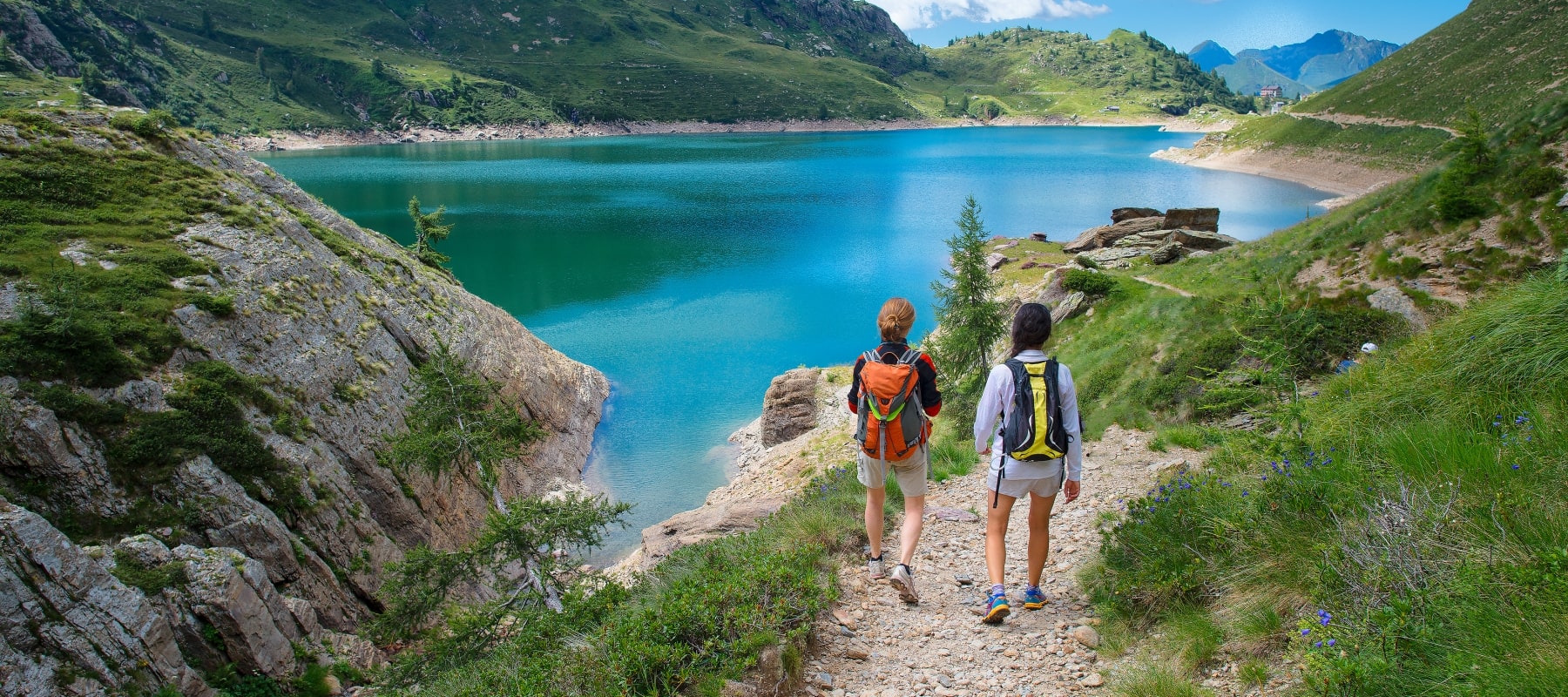 Two women enjoying view of lake